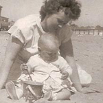 Mother and baby on the beach