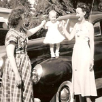 Baby standing on a car