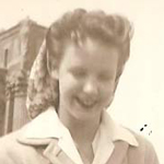 A woman holding a dog