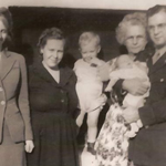 Family standing on grass